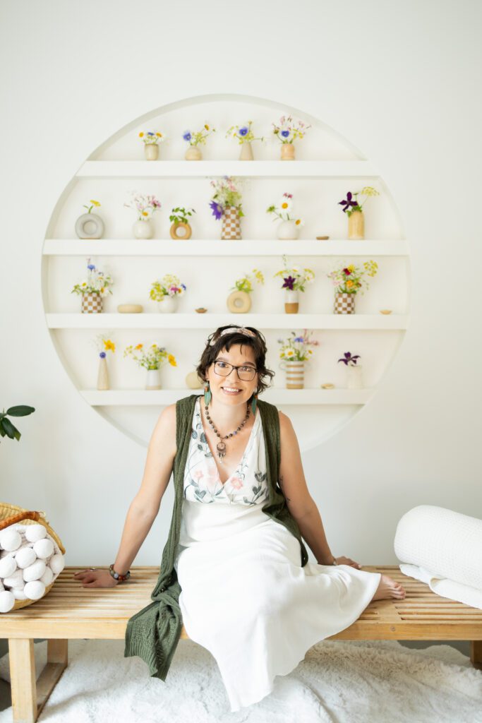 woman seated in styled studio during brand photography in Lincoln, Nebraska