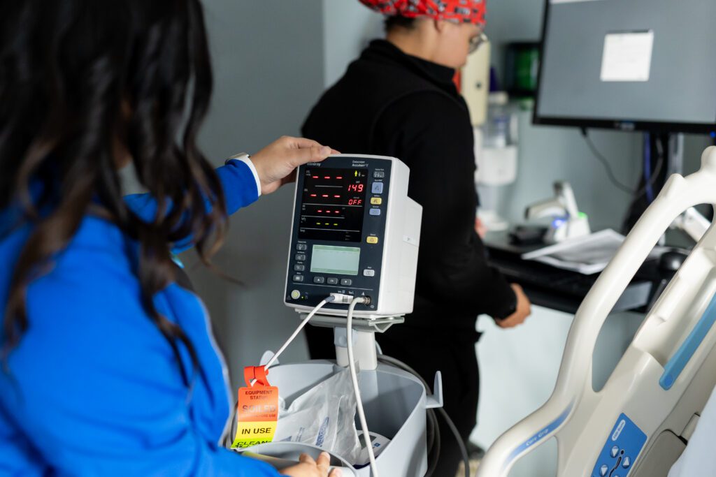 close-up of medical monitor displaying patient vital signs in clinical setting