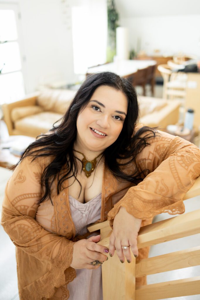 professional portrait of woman leaning on chair in Lincoln, Nebraska