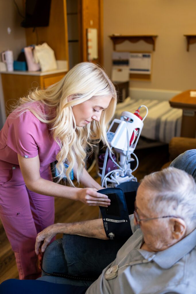 nurse assisting elderly patient with care in healthcare setting
