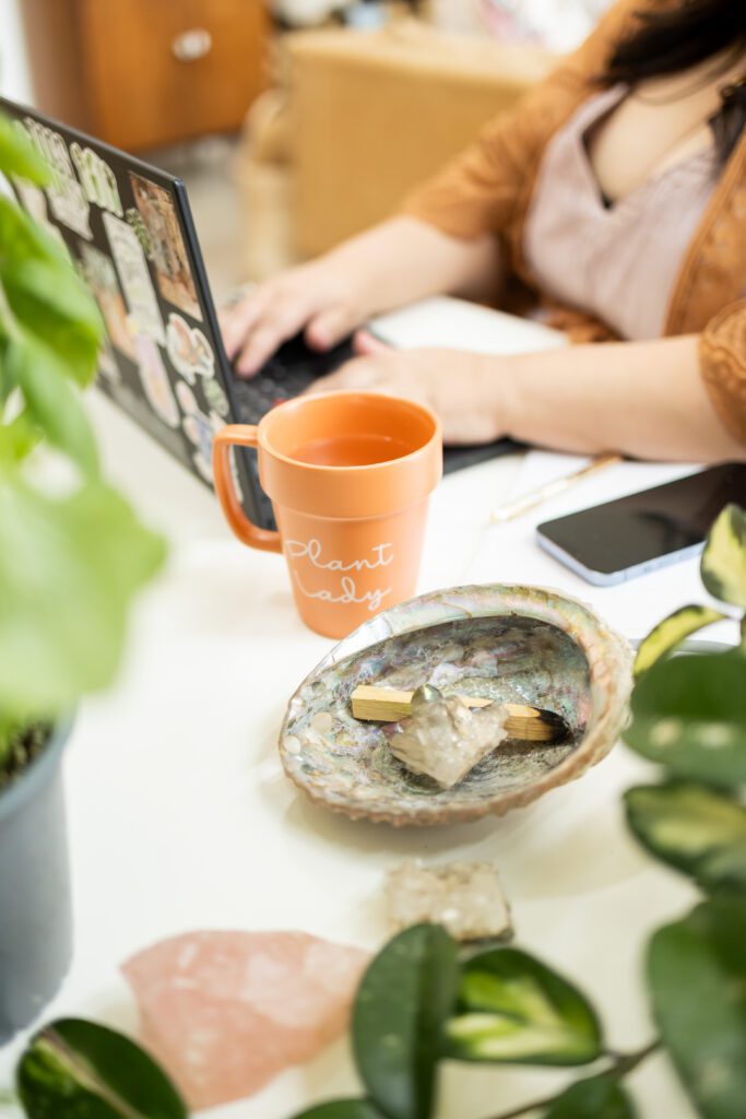 styled workspace with laptop and coffee for brand photography