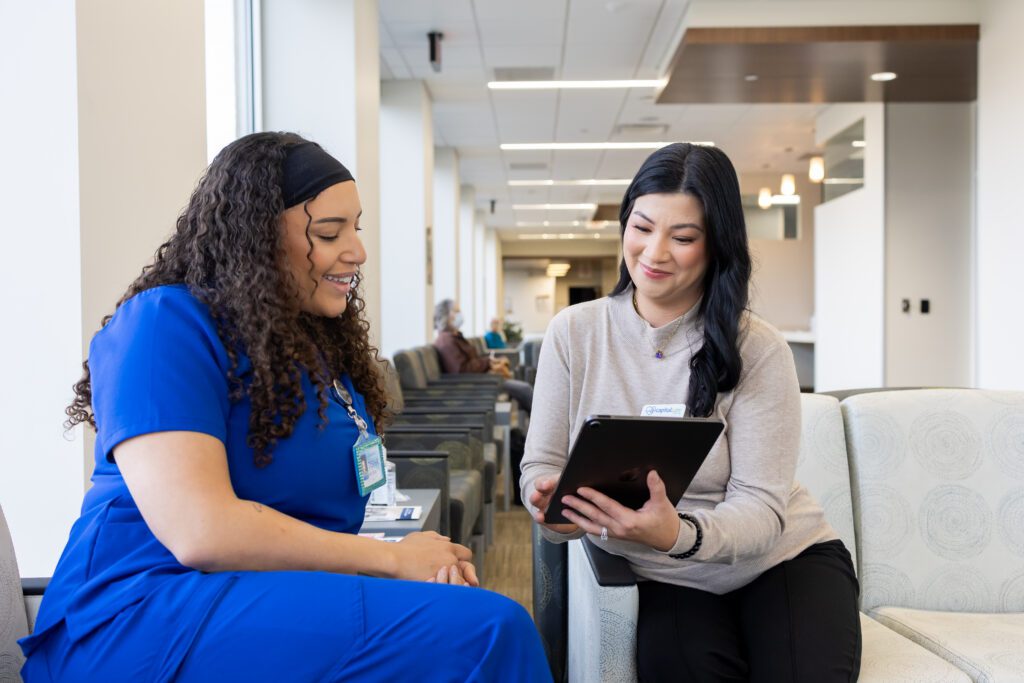 healthcare professionals having consultation discussion using tablet