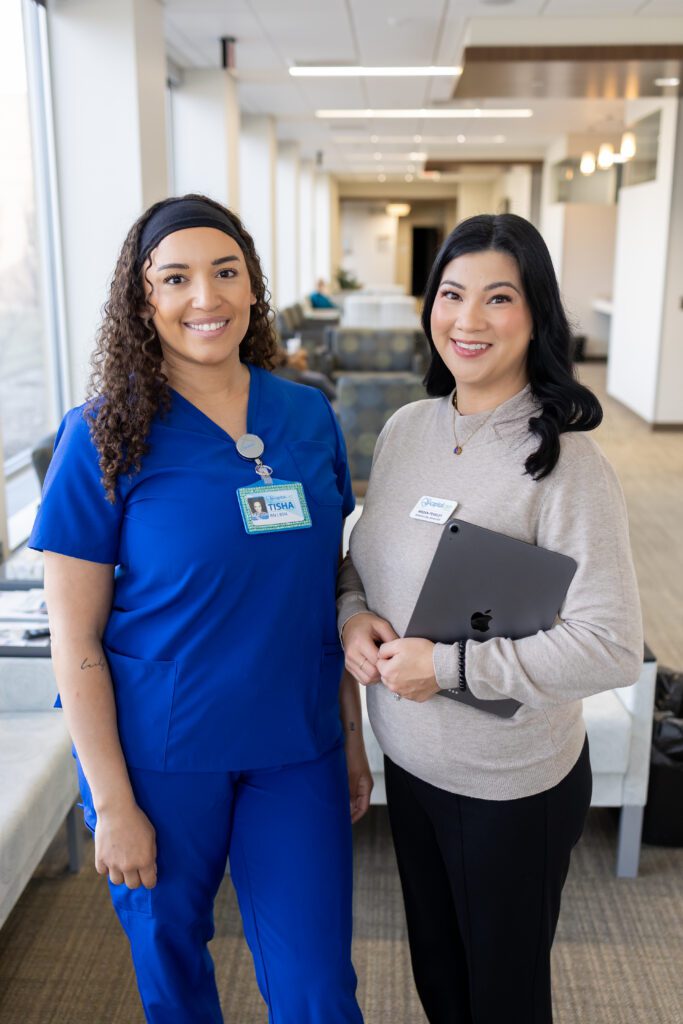 healthcare staff posing for professional brand photography with clipboard