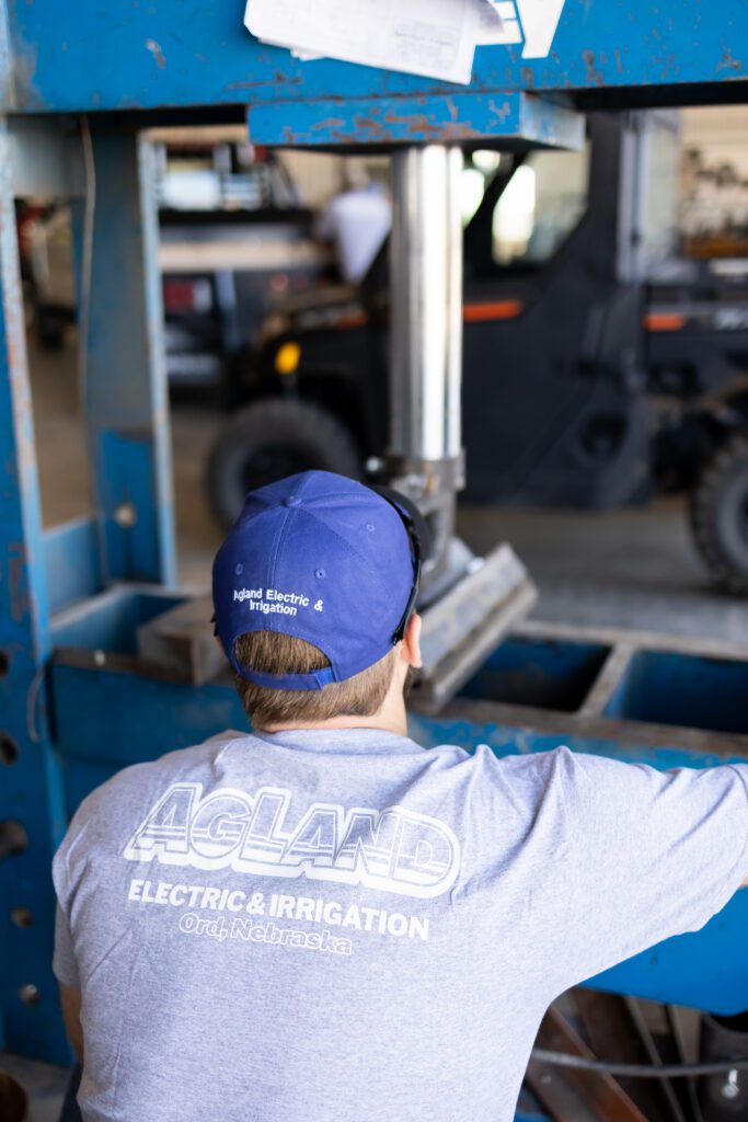 behind the scenes view of technician working on machinery