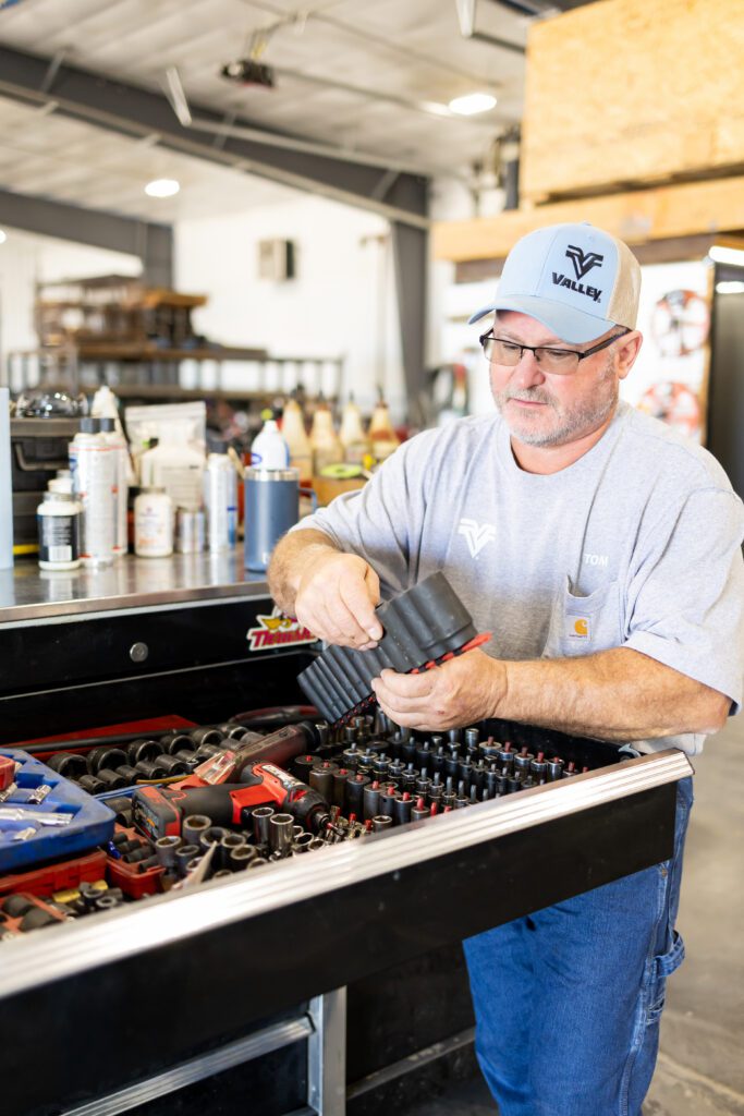 technician organizing tools in industrial workspace