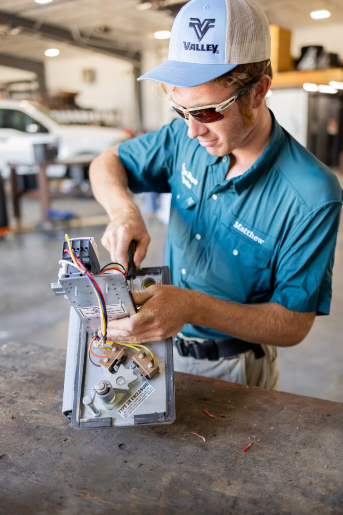 technician repairing electrical wiring