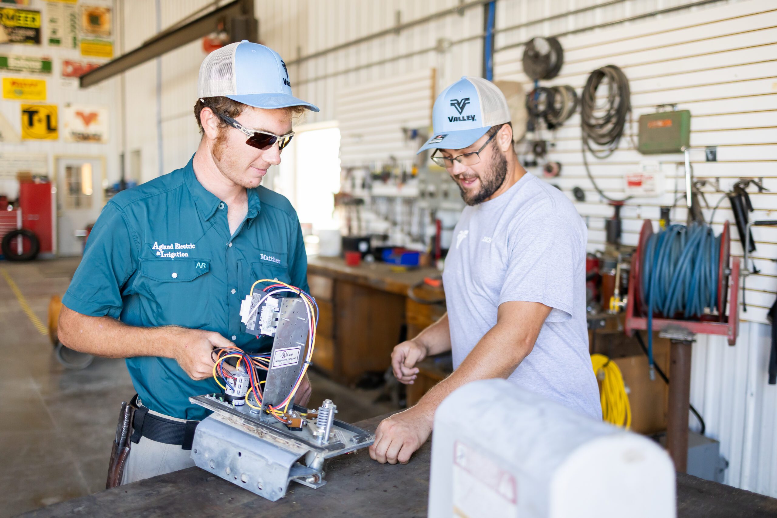 two technicians working on equipment during brand photography session